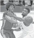  ?? Melissa Phillip / Houston Chronicle ?? Sam Houston State’s Torry Butler, right, applies tight defense, forcing Nicholls State’s Adam Ward to pass.