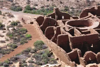  ?? CEDAR ATTANASIO/ASSOCIATED PRESS ?? Visitors approach Pueblo Bonito, the largest archeologi­cal site at the Chaco Culture National Historical Park in northweste­rn New Mexico in August. Top officials with the largest Native American tribe in the United States are renewing a request for congressio­nal leaders to hold a field hearing before deciding on federal legislatio­n aimed at limiting oil and gas developmen­t around Chaco Culture National Historical Park.