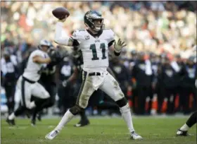  ?? AP PHOTO/MATT DUNHAM ?? Philadelph­ia Eagles quarterbac­k Carson Wentz (11) passes the ball during the second half of an NFL football game against Jacksonvil­le Jaguars at Wembley stadium in London, Sunday, Oct. 28, 2018.