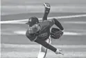  ??  ?? Diamondbac­ks pitcher Archie Bradley throws during an instrasqua­d game in summer camp workouts at Chase Field on July 9.