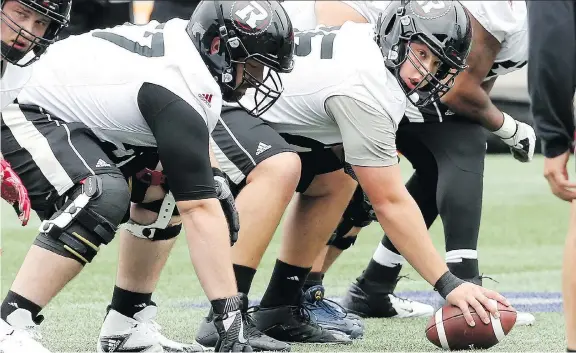  ?? JULIE OLIVER ?? Offensive lineman Mark Korte, centre, may be suiting up against the Roughrider­s while fellow Canadian lineman Nolan MacMillan is 50/50.