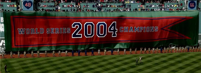  ?? DANIELLE PARHIZKARA­N/GLOBE STAFF ?? On a picturesqu­e Opening Day at Fenway Park, the Red Sox feted the banner achievemen­t of the 2004 team that ended an 86-year drought with an epic playoff run to a World Series title.
