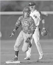  ?? Karen Warren photos / Houston Chronicle ?? Pearland’s Jacob Whitehead rounds third base to score on a double by Parker Deleon in the third inning of the Oilers’ 8-3 win over George Ranch.