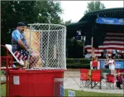  ??  ?? LEFT: RFPR Director Kevin Cowling drops in the dunking booth set up to raise money for the Rome Police K9 Unit and Rome-Floyd Special Olympics.