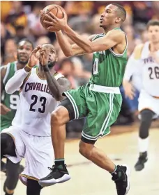  ?? KEN BLAZE, USA TODAY SPORTS ?? Avery Bradley, right, scored 20 points, including the decisive three-pointer, in the Celtics’ Game 3 upset Sunday.