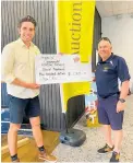  ?? ?? Ray White selling principal Reuben van Dorsten presents a cheque to Doug Walters from Coromandel Rescue Trust.