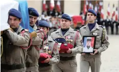  ??  ?? SOLDIERS carry a coffin during a ceremony for the 13 French soldiers killed in Mali, at the Invalides Monument in Paris, France, yesterday. | Reuters