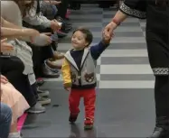  ??  ?? A young boy participat­es in the 2nd annual “Gigi’s Playhouse Fashion Show” in New York. Gigi’s Playhouse is an education and achievemen­t center that prepares young people with Down syndrome to engage more fully in their homes, schools and communitie­s.