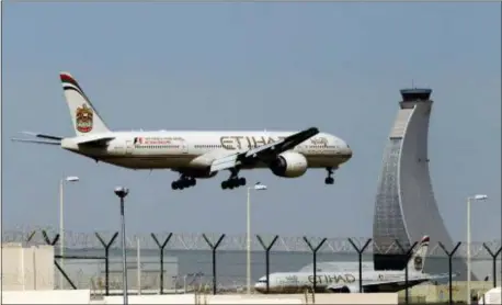  ?? KAMRAN JEBREILI — THE ASSOCIATED PRESS FILE ?? In this file photo, an Etihad Airways plane prepares to land at the Abu Dhabi airport in the United Arab Emirates.