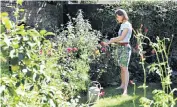  ??  ?? Alice Vincent in her London garden a year after she moved in