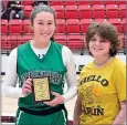 ?? Courtesy photograph ?? A player from the Green County, Okla., Lady Defenders was presented with the Talina McDonald Memorial Hustle Award presented by Madison and Noah McDonald and Jayden Spillman. The Lady Defenders lost to the Star City Bulldogs 37 to 61 in the second game on the first day of the tournament.
