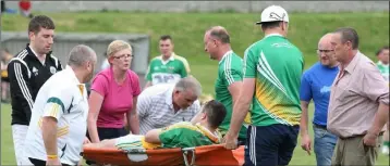  ??  ?? Duffry Rovers defender Donie Doyle receives treatment after his unfortunat­e injury.