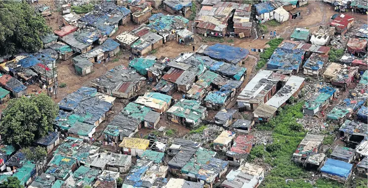  ?? Picture: JACKIE CLAUSEN ?? PICTURE OF FAILURE: A shanty town in Pietermari­tzburg, KwaZulu-Natal, a product of growth that has remained too far below target for South Africa’s debilitati­ng poverty to be reduced