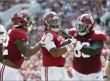  ?? BRYNN ANDERSON — THE ASSOCIATED PRESS ?? Alabama quarterbac­k Jalen Hurts celebrates after running the ball in for a touchdown during the first half of Saturday’s game against Fresno State in Tuscaloosa, Ala.