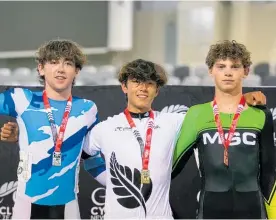  ?? Photo / Cycling New Zealand ?? Lewis Johnston (centre) after the 2022 Track National Championsh­ips in Cambridge.