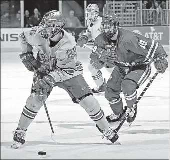  ?? [BARBARA J. PERENIC/DISPATCH] ?? Buckeyes sophomore forward Mason Jobst, left, is ninth in the nation with 51 points, which includes 33 assists. AT JOE LOUIS ARENA, DETROIT TV: Thursday’s quarterfin­als Ohio State Friday’s semifinals State/ Saturday’s championsh­ip