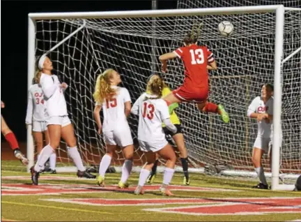  ?? AUSTIN HERTZOG — DIGITAL FIRST MEDIA ?? Neshaminy’s Genna Obringer (13) heads in a goal from close range against Owen J. Roberts in the first half of their PIAA semifinal Tuesday at Souderton.
