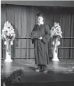  ?? CONTRIBUTE­D ?? Camden Gouthro, 17, stops for his family to snap his picture after crossing the stage at Sydney Academy with his diploma on June 18.