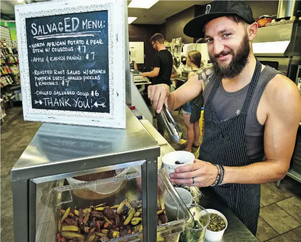  ?? ED KAISER/EDMONTON JOURNAL ?? Chef Eric Hanson prepares a roasted root-vegetable salad at SalvagED, a pop-up lunch at Earth’s General Store Cafe.