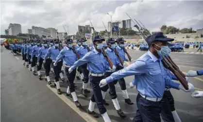  ?? Photograph: Ben Curtis/AP ?? Ethiopian police march in Meskel square in Addis Ababa earlier this month. The state of emergency was imposed after the TPLF claimed to have captured several towns in recent days.