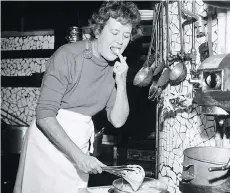  ??  ?? Julia Child in the kitchen in France, circa 1950s. PAUL CHILD/THE SCHLESINGE­R LIBRARY, RADCLIFFE INSTITUTE, HARVARD UNIVERSITY