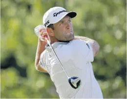  ?? DARRON CUMMINGS/ASSOCIATED PRESS ?? Jon Rahm hits from the 18th tee in the third round of the Memorial tournament Saturday. Seeking to become the second Spaniard to reach No. 1 in the world, he leads by four shots.