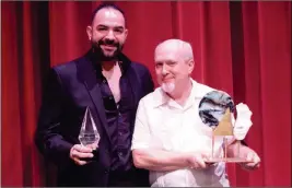  ?? Buy this photo at YumaSun.com PHOTO BY RACHEL TWOGUNS/YUMA SUN ?? MUSICIAN, MARKETER AND ADVERTISIN­G PRODUCER Colby Girard (right) was named the 2018 Tribute of the Muses Award winner on Friday night. Founder of a local art collective and restaurant owner Abraham Andrade (left) took home the 2018 Helios Award.