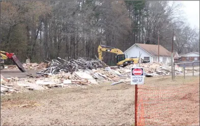  ?? Brittany Williams/News-Times ?? Demolition: ERC General Contractor­s has begun the demolition process of the old gym, located near the high school campus.