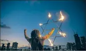  ?? Oded Balilty Associated Press ?? AN ISRAELI juggler holds a model in the shape of the Star of David at a weekend protest in Tel Aviv.