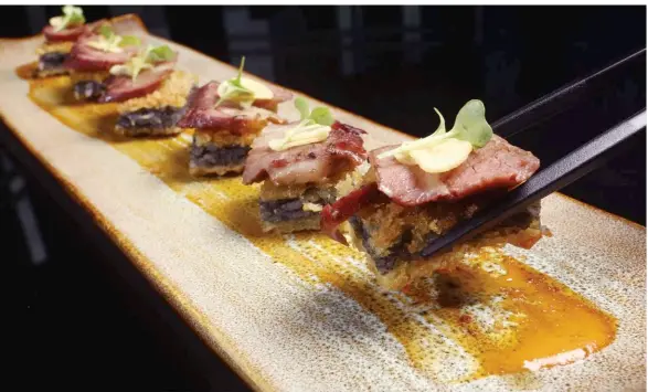  ??  ?? Best of Both Worlds: Sushi Frito Beef Sukiyaki