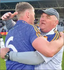  ??  ?? Wicklow manager John Evans congratula­tes Dean Healy after the wonderful win over Offaly in the Leinster championsh­ip.