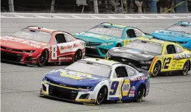  ?? Paul Sancya/Associated Press ?? Chase Elliott (9) races with Kyle Busch (8), Denny Hamlin (11) and Ryan Blaney (12) during a NASCAR Cup Series auto race at Michigan Internatio­nal Speedway Sunday in Brooklyn, Mich.
