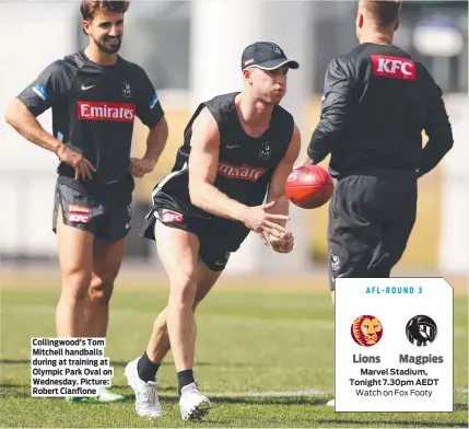  ?? ?? Collingwoo­d’s Tom Mitchell handballs during at training at Olympic Park Oval on Wednesday. Picture: Robert Cianflone