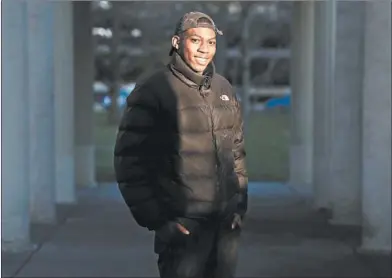  ?? TERRENCE ANTONIO JAMES/CHICAGO TRIBUNE ?? Demario Reed, 21, seen here in Chicago on Friday, completed the restorativ­e justice court program in North Lawndale.