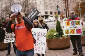  ?? Carolyn Kaster / Associated Press ?? Protesters rally outside the Department of Justice in Washington this month against the Sackler family, which sought to shield itself from opioid litigation.