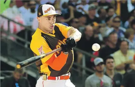  ?? Harry How Getty Images ?? Miami’s Giancarlo Stanton competes in the home run derby. He bested Todd Frazier of the White Sox in the final. BLAST HURRAH