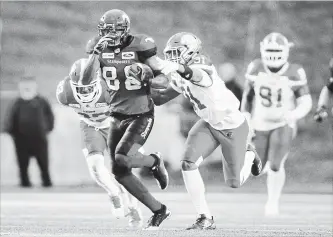  ?? JEFF MCINTOSH THE CANADIAN PRESS ?? Calgary Stampeders’ Kamar Jorden, pictured on the run, had 185 receiving yards in a 27-18 win over B.C.