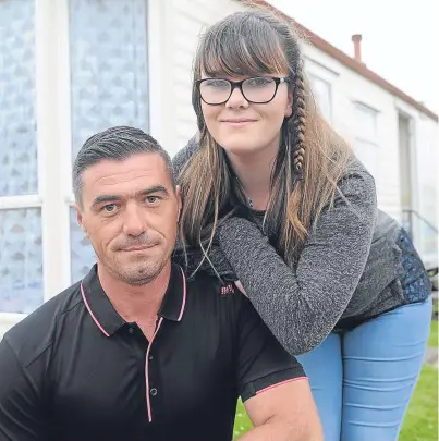  ?? Picture: Kim Cessford. ?? Jamie and Kaitlynn McEwan after their drama on Monday when Kaitlynn’s inflatable drifted out to sea and Jamie had to swim to rescue his daughter.