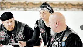  ?? SUZANNE TENNANT/POST-TRIBUNE ?? BACA Vice President “Shield,” “Smurfette” and “Mr. Clean,” chapter secretary, attend a Northwest Indiana chapter of Bikers Against Child Abuse meeting in Rensselaer.