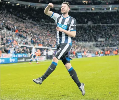  ??  ?? Paul Dummett celebrates after scoring the third goal for Newcastle.