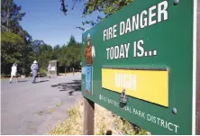  ?? Paul Chinn / The Chronicle ?? A fire warning is posted in Tilden Regional Park near Orinda.