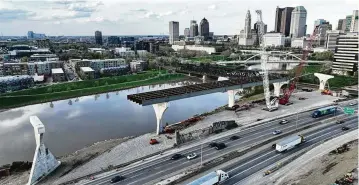  ?? DORAL CHENOWETH / COLUMBUS DISPATCH ?? Work on the I-70/71 highway through downtown Columbus won’t be completed until at least 2030. Ohio has a total of 26,960 bridges and culverts, the second most in the U.S. behind Texas. More than 1,250 of them are in “poor” condition, according to the Federal Highway Administra­tion.