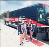  ?? Steve Baldwin / Contribute­d photo ?? The Brookfield field hockey team boards a coach bus to a game at Nonnewaug in Woodbury on Tuesday. Brookfield is one of many school districts that have had to find alternativ­e modes of transporta­tion due to a bus shortage.