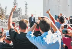  ?? THE ASSOCIATED PRESS ?? President Donald Trump stops to look at the crowd as he takes the stage to speak Wednesday at the Andeavor Refinery in Bismarck, N.D., to promote his tax overhaul plan.