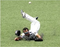  ?? Eric Gay/ Associated Press ?? Tennessee Tech outfielder Collin Harris (1) misses the ball as he dives for a hit by Texas pitcher Ryan Reynolds (5) in the second inning of an NCAA college super regional baseball game on Sunday in Austin.