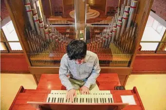  ?? ?? Xu says playing the organ with The Woodlands Community Presbyteri­an Church on Sundays allows him to maintain his musical skills.