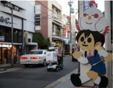  ?? MICHAEL VITE/THE ASSOCIATED PRESS FILE PHOTO ?? This 2014 photo shows fan art from the anime series Tamako Market at the Demachi Masugata Shotengai in Kyoto, Japan.