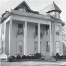  ?? T&G FILE PHOTO ?? The two-story porch on the front of the house was not part of the original design.