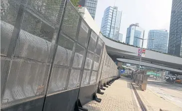  ??  ?? NO WAY THROUGH: Barricades set up outside the Legislativ­e Council building are seen in Central district, Hong Kong, China on Friday.