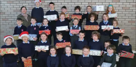  ??  ?? Above: Some of the children from Banteer National School who took part in the Christmas Shoe Box Appeal.